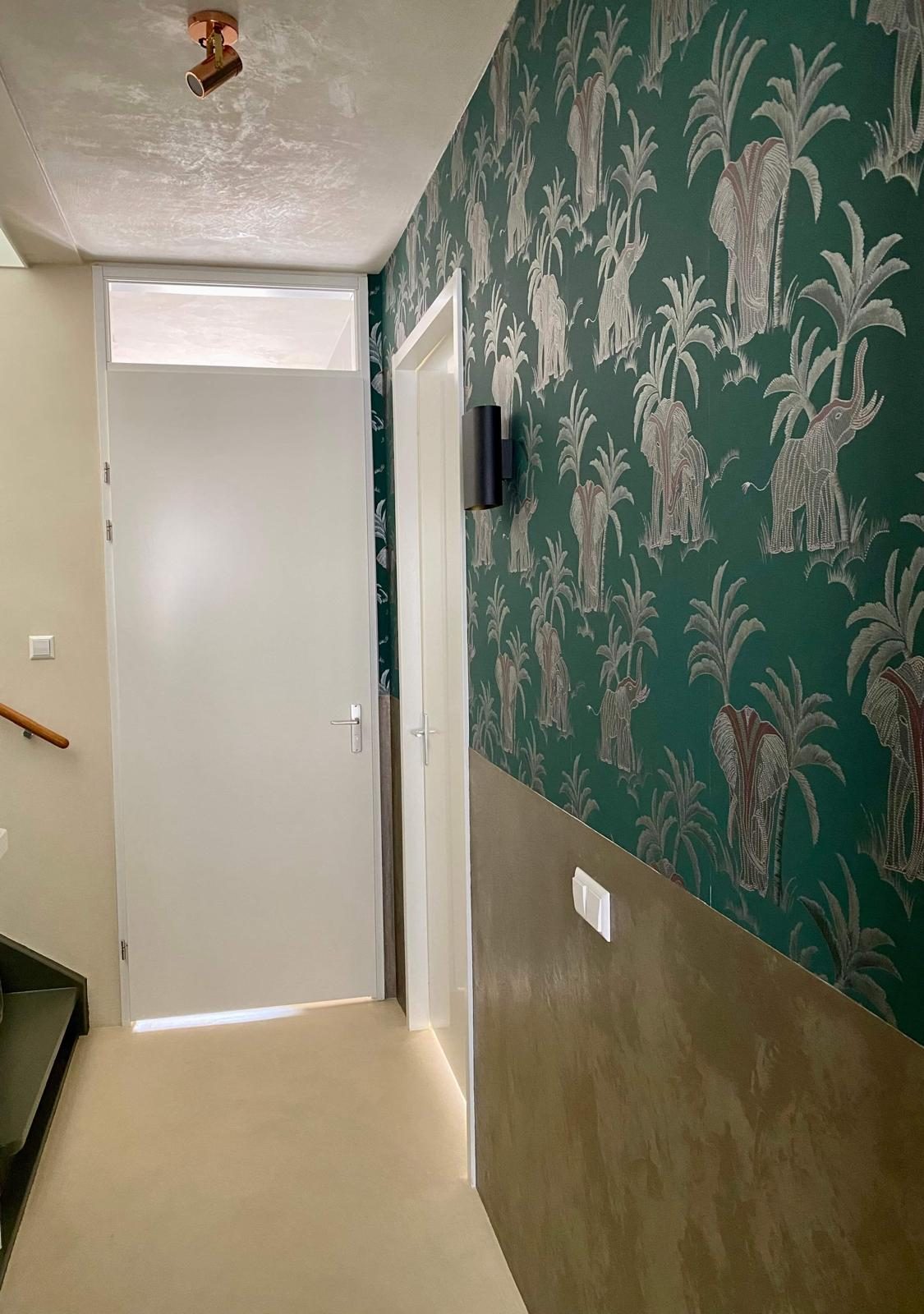 Floating wood shelf on plaster wall