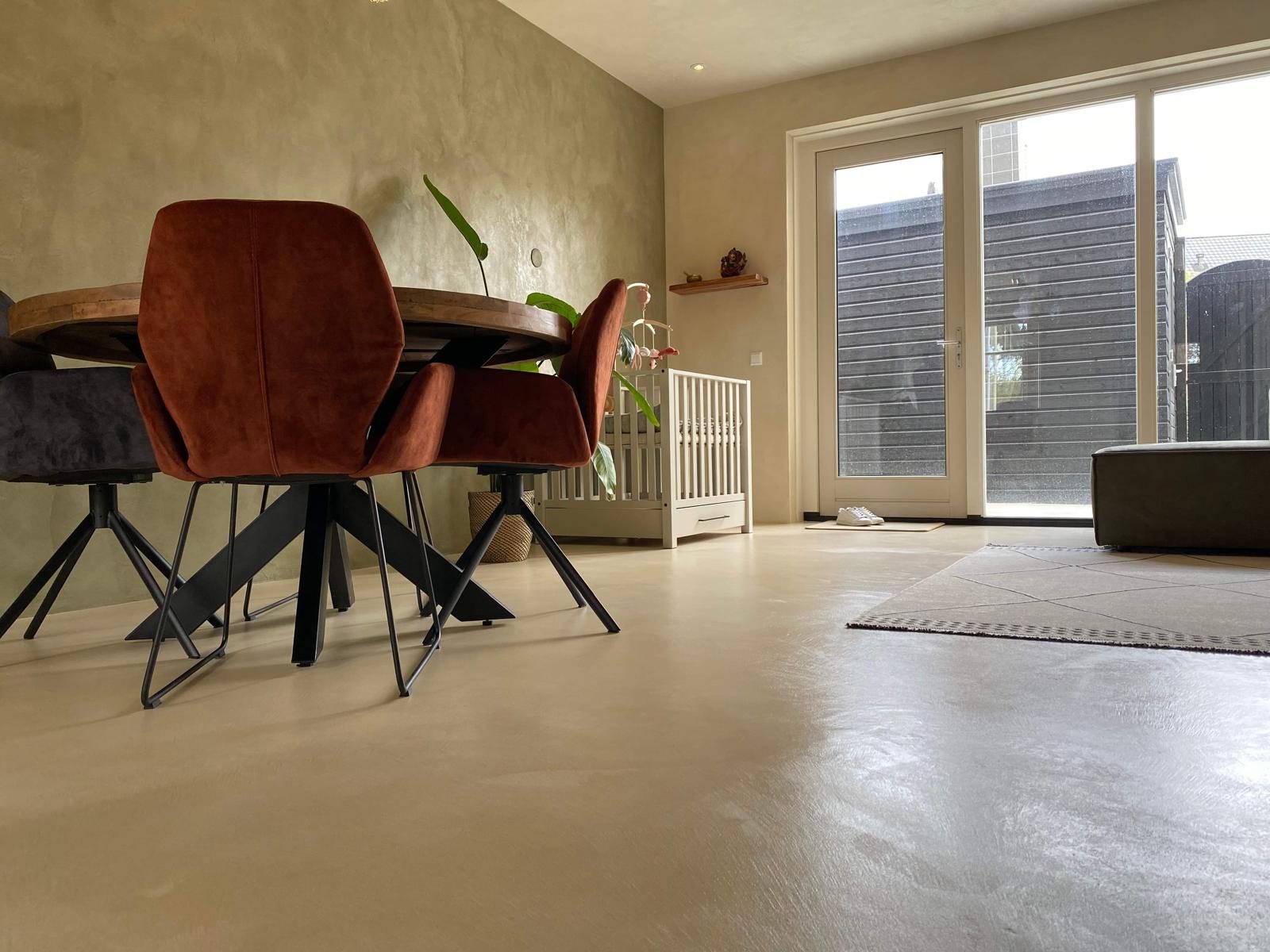Living room with brown leather sofa and microcement walls