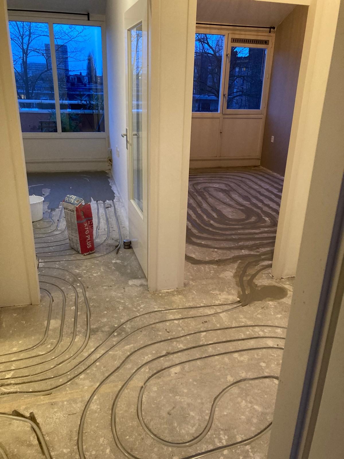 Floor heating loops being installed