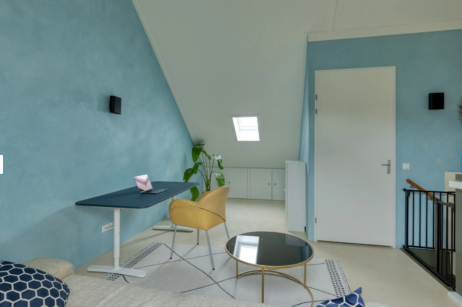 Attic workspace in soft blue lime paint
